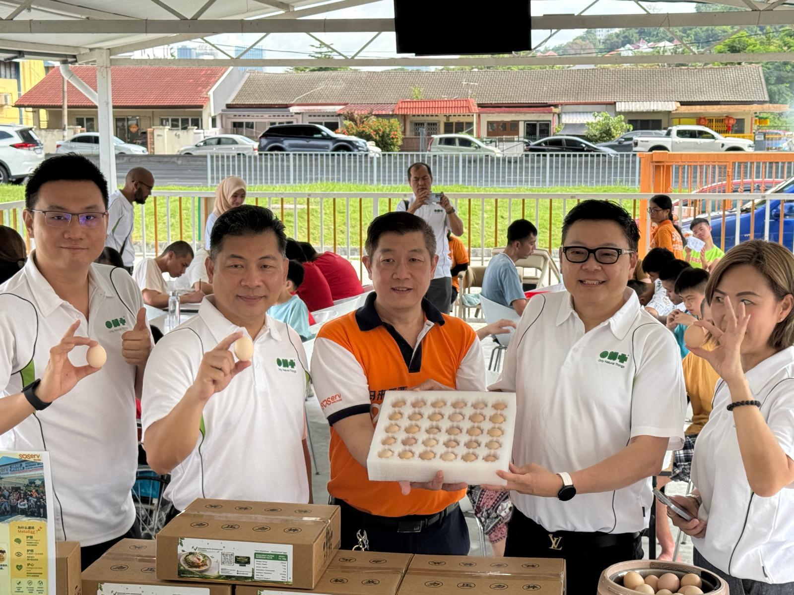 The Malaysian team sharing MetaEggs during a community visit to SOSERV Welfare in Kuala Lumpur.